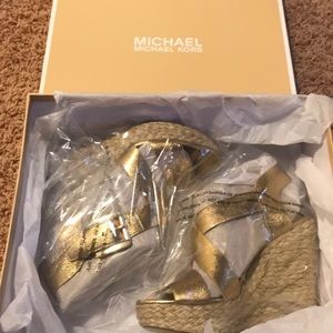 Brand new Michael Kors gold wedges!